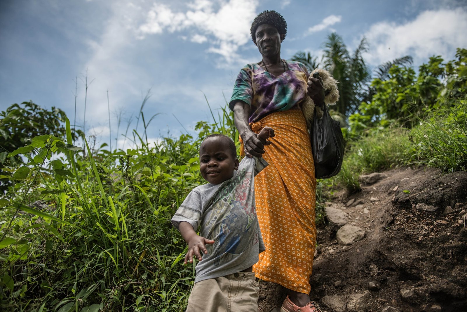 Criscent, his Brother and his Grandmother walking home from school.